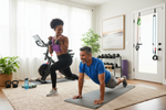 Couple in their 50s working out at home